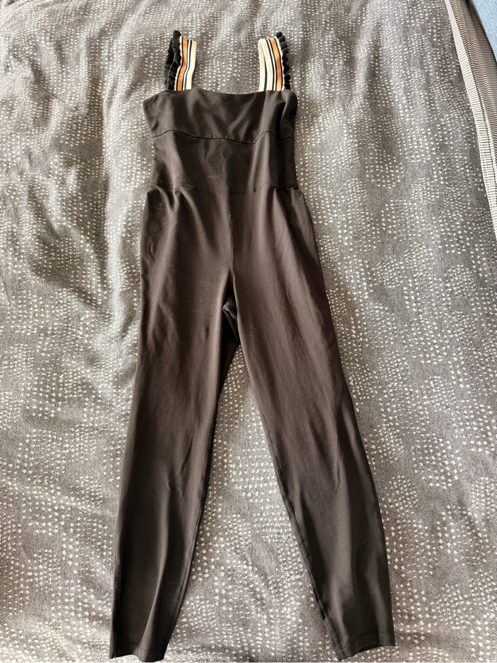 Free People Onsie. Black Jumpsuit with Striped Shoulder Straps.
